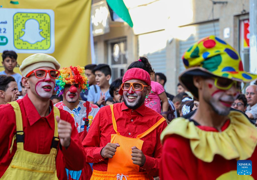 Palestinian young men dress as clowns to entertain children in northern Gaza Strip