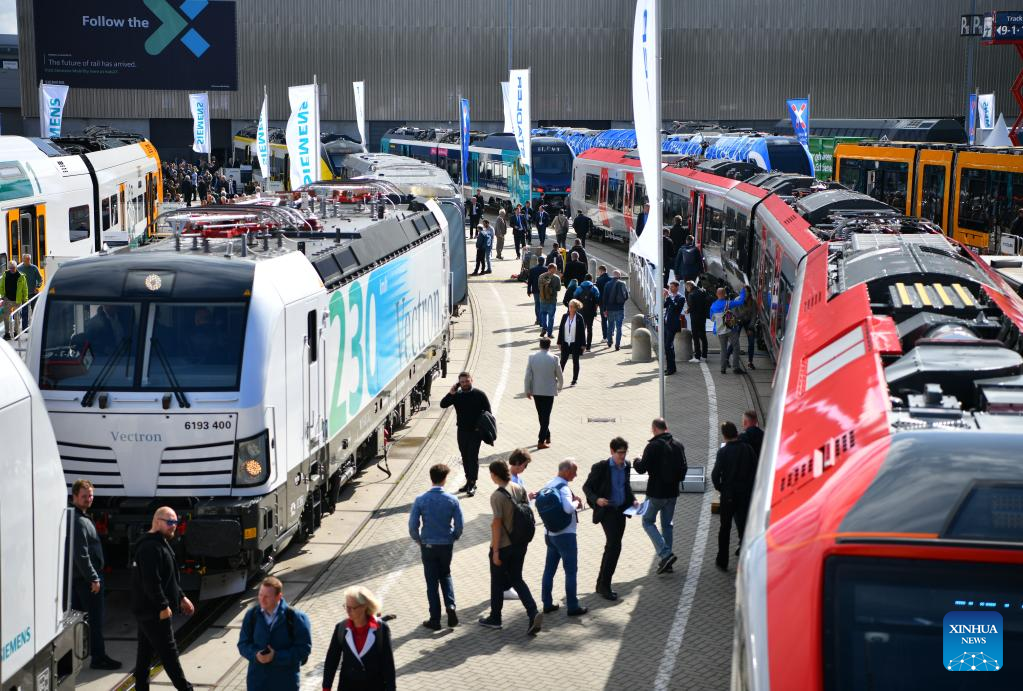 People visit railway industry trade fair in Germany