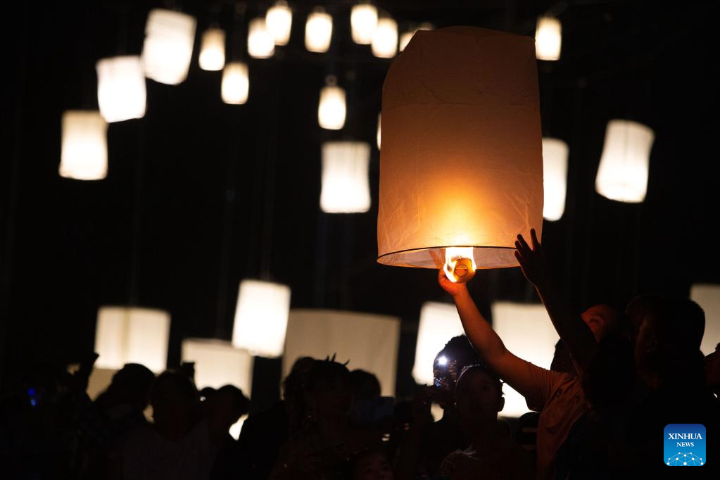 People release sky lantern to make wish for good fortune in Chiang Mai, Thailand