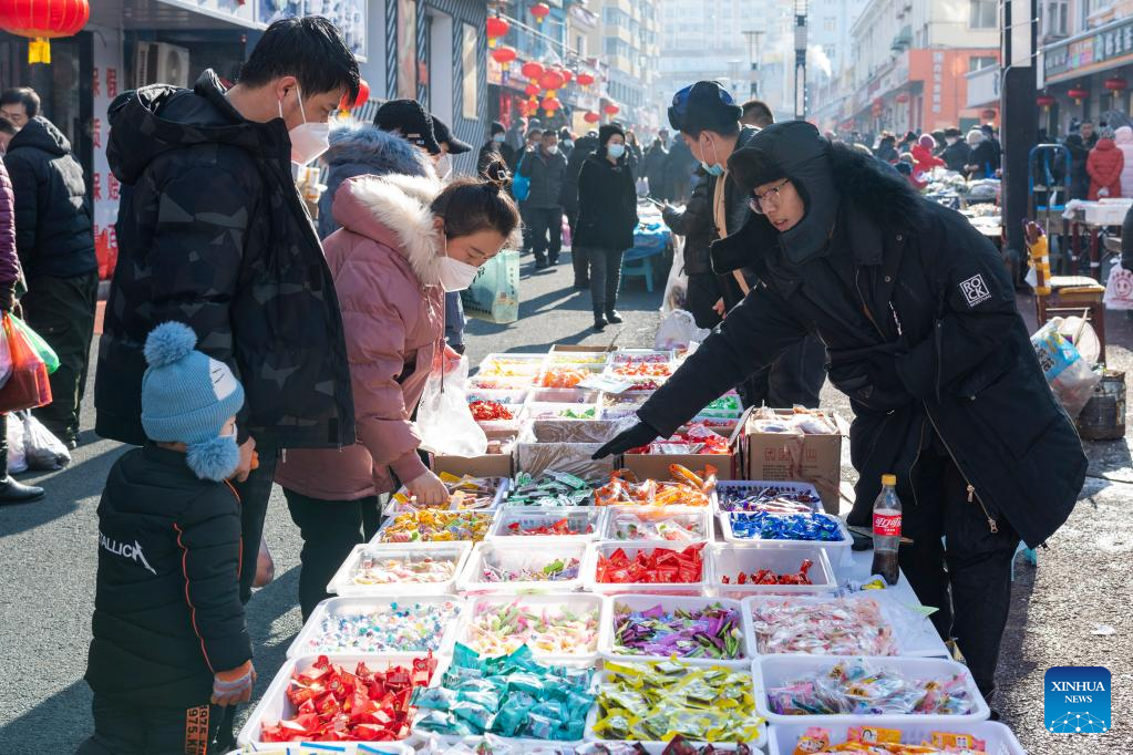 Local residents shop for upcoming Spring Festival in Suifenhe, NE China