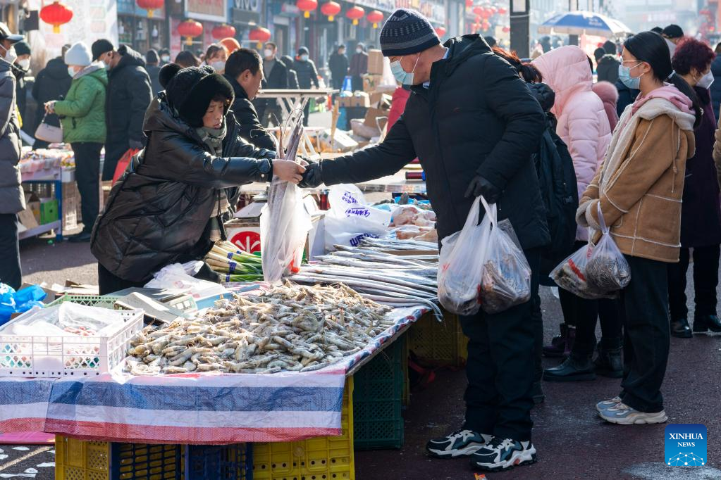 Local residents shop for upcoming Spring Festival in Suifenhe, NE China