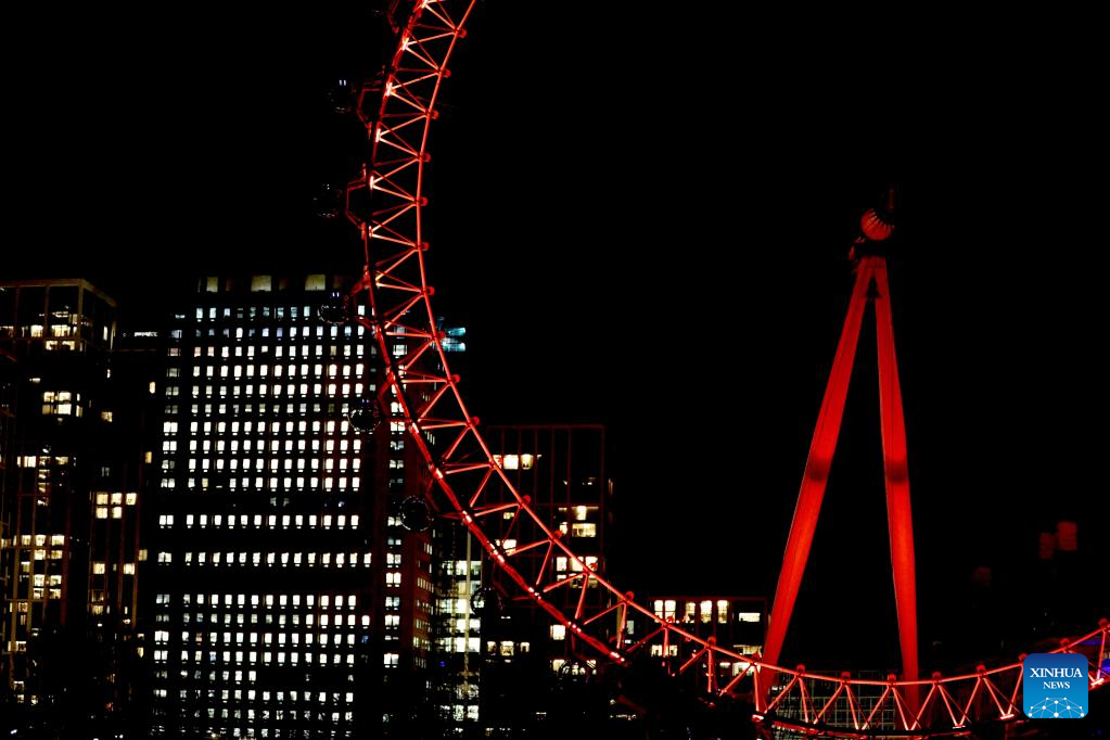 London Eye illuminated in red to celebrate upcoming Chinese New Year