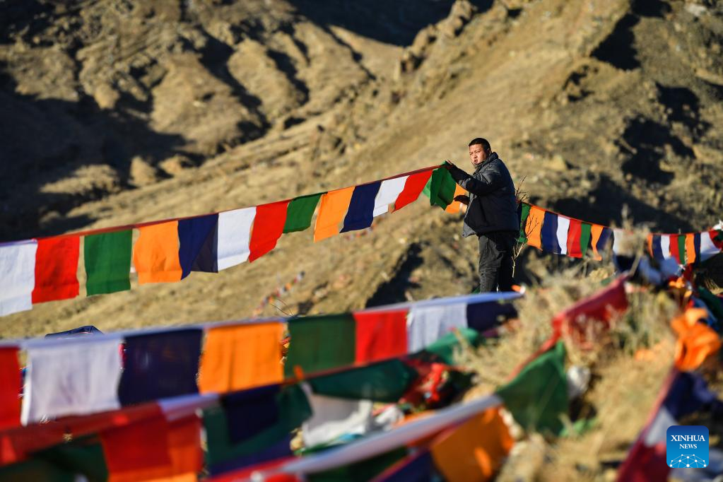 People hang prayer flags to celebrate New Year under Tibetan calendar in Xigaze, Tibet