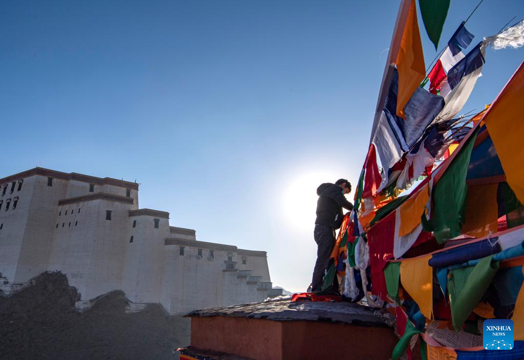 People hang prayer flags to celebrate New Year under Tibetan calendar in Xigaze, Tibet