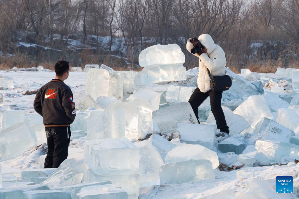 People have fun with ice cubes in northeast China's Heilongjiang