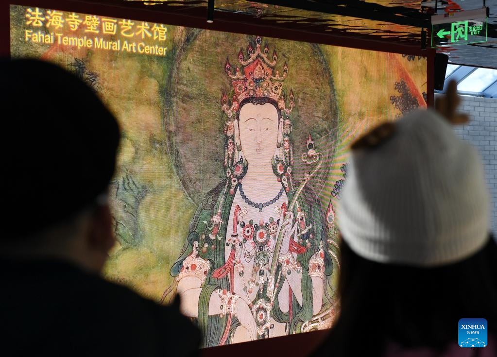 Tourists visit Fahai Temple Mural Art Center in Beijing