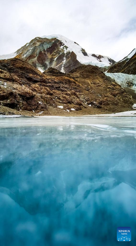 View of icy lake at foot of Mount Qungmknag in Lhasa