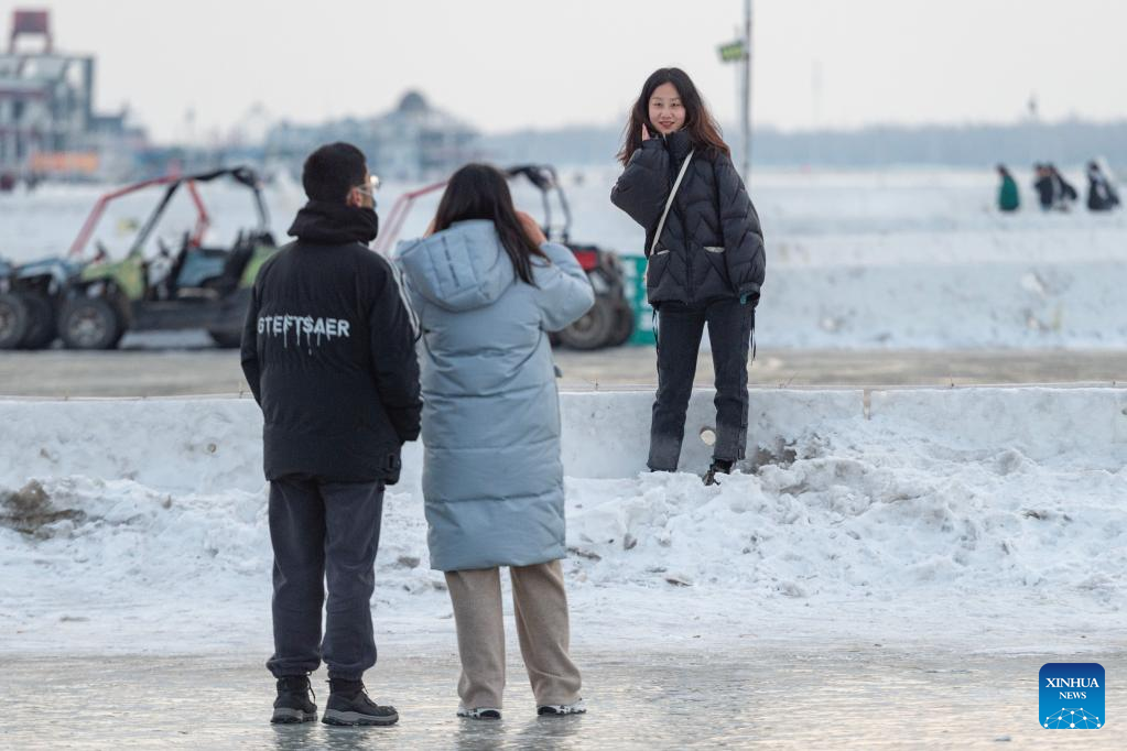 Tourists have fun at Harbin Songhua River Ice and Snow Carnival