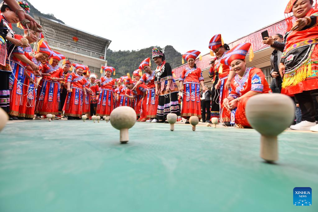 Spining top competition held to celebrate upcoming Int'l Women's Day in S China's Guangxi