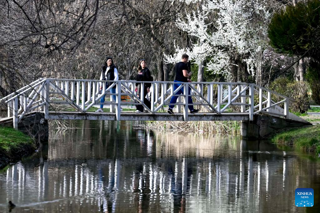 People enjoy scenery at park in Skopje, North Macedonia