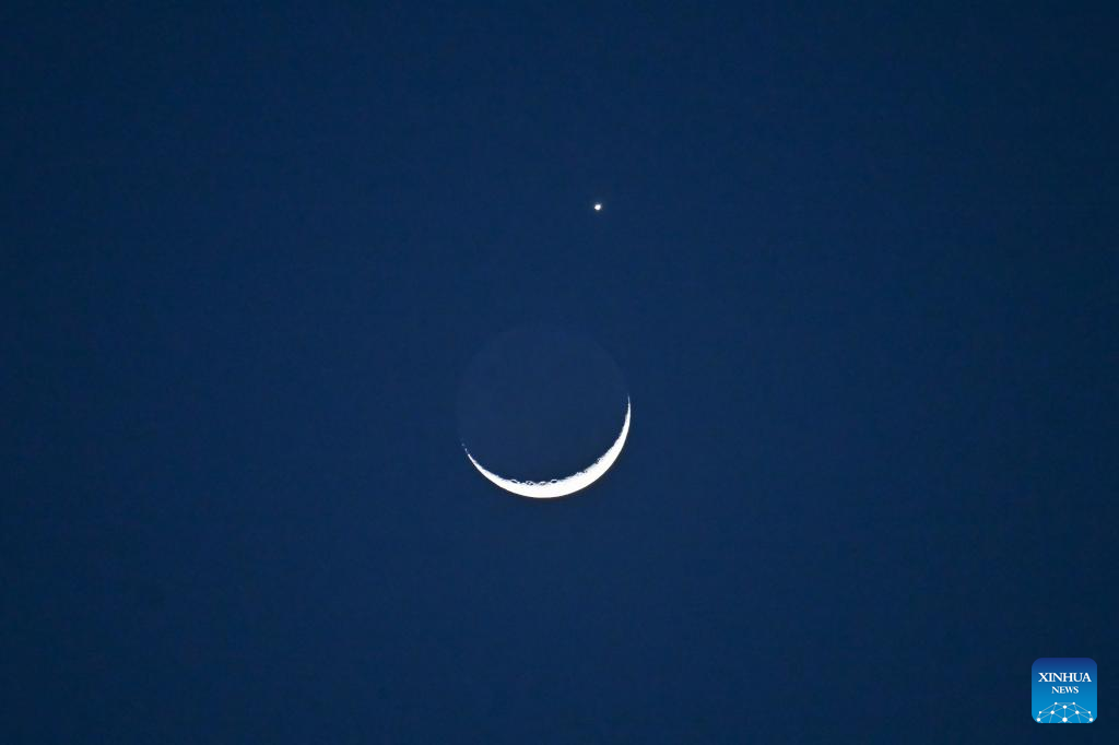 Lunar occultation of Venus pictured in Beijing