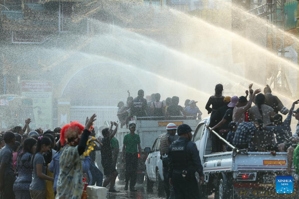 People spray water to celebrate water festival in Myanmar