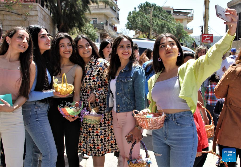 People in south Lebanon play egg tapping to celebrate Easter