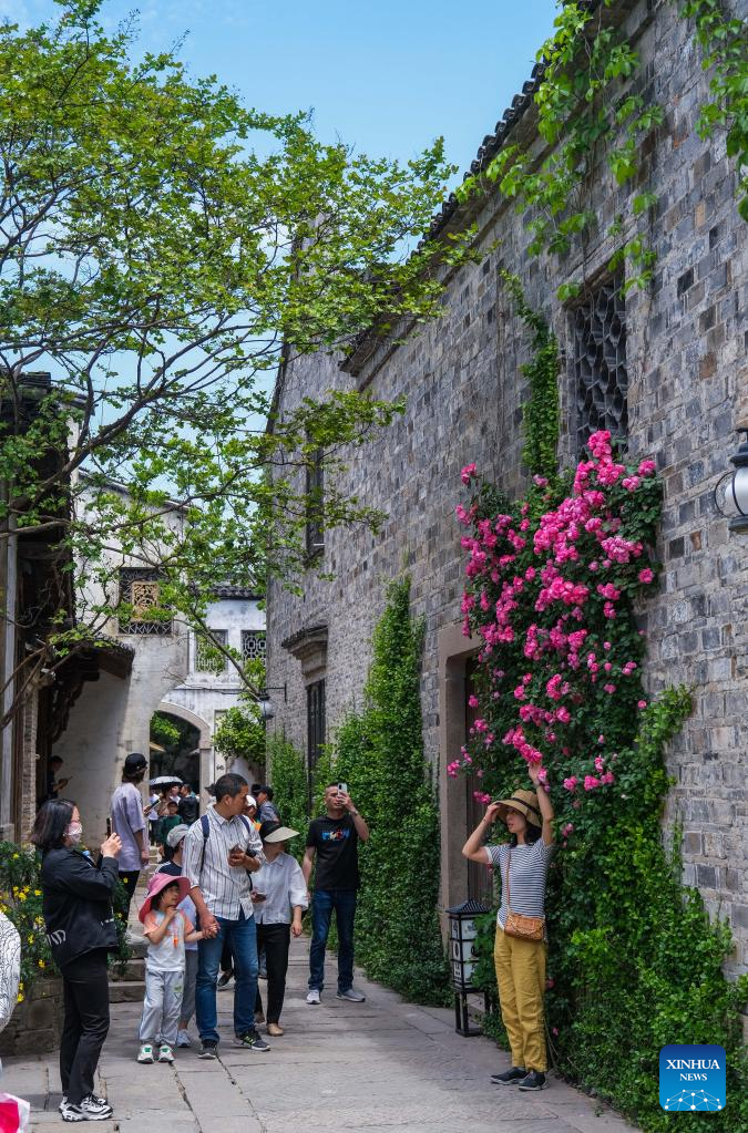 Tourists visit Puyuan Fashion Resort in China's Zhejiang