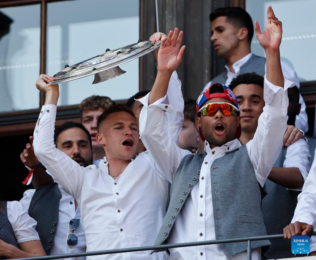 Bayern Munich players greet fans during celebration