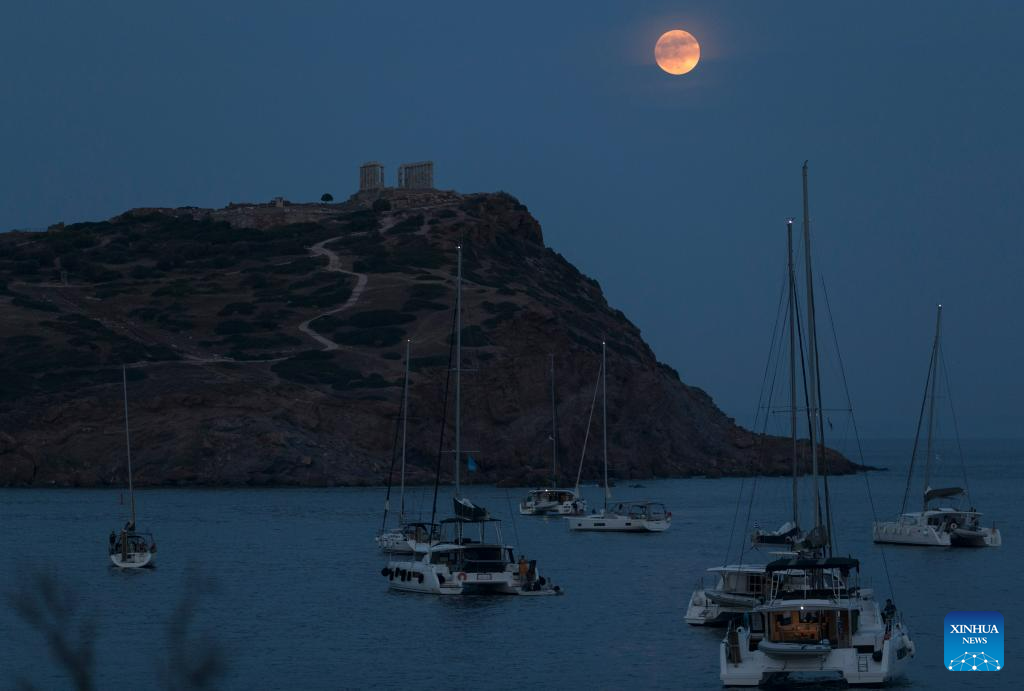 View of full moon in Sounion, Greece