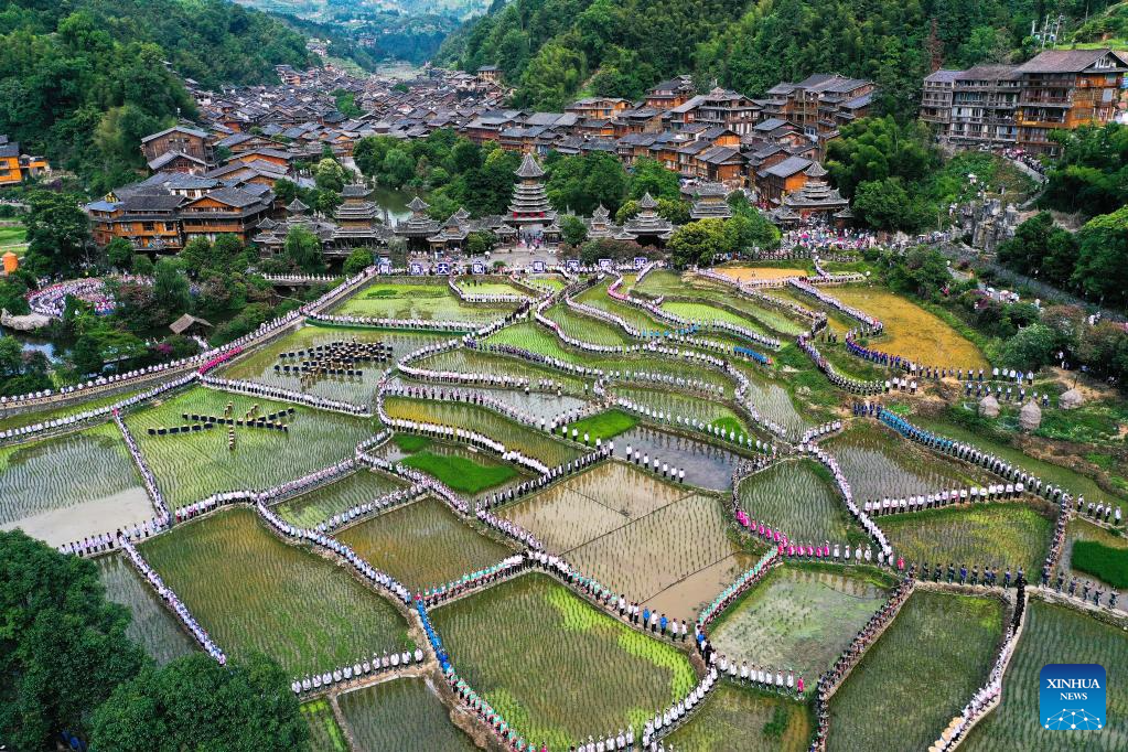 People participate in folk music performance in SW China's Guizhou