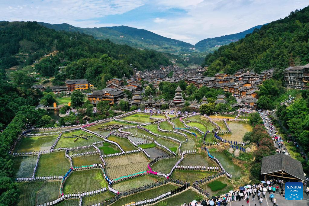 People participate in folk music performance in SW China's Guizhou