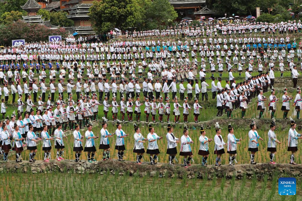 People participate in folk music performance in SW China's Guizhou