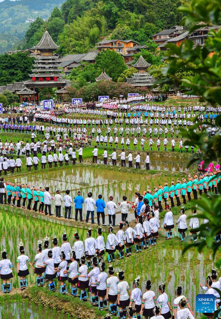 People participate in folk music performance in SW China's Guizhou