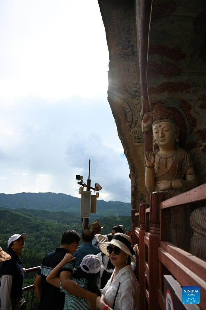 People visit Maijishan Grottoes in Tianshui City, NW China