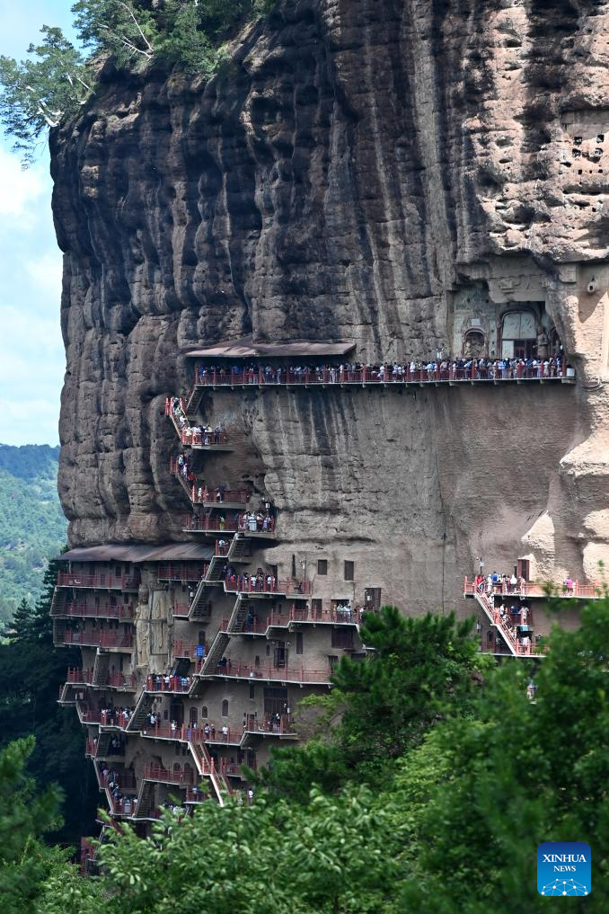 People visit Maijishan Grottoes in Tianshui City, NW China