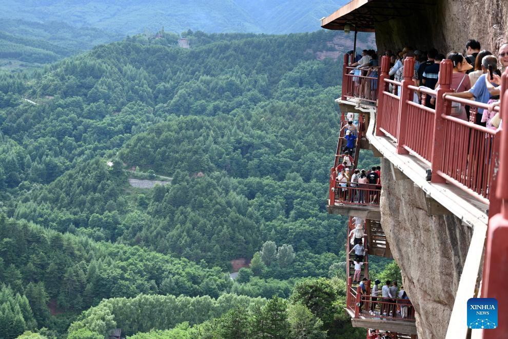 People visit Maijishan Grottoes in Tianshui City, NW China