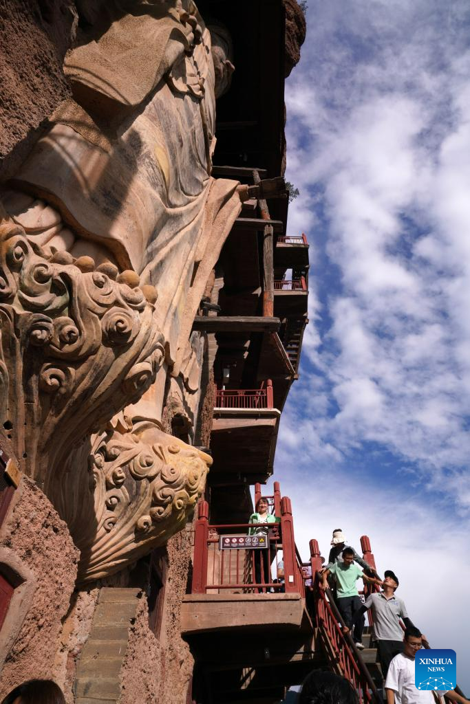 People visit Maijishan Grottoes in Tianshui City, NW China