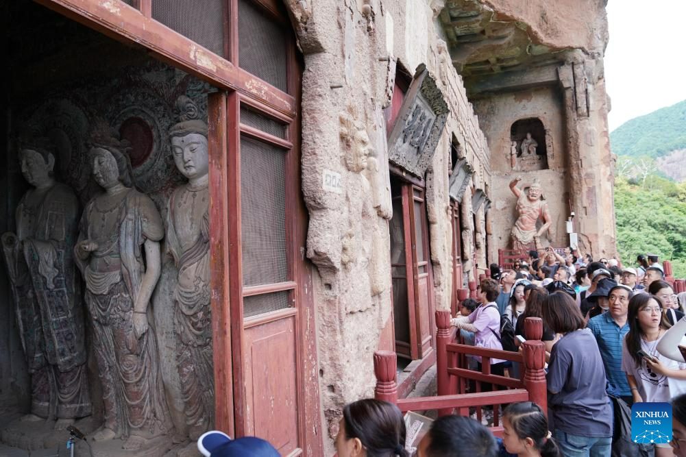 People visit Maijishan Grottoes in Tianshui City, NW China