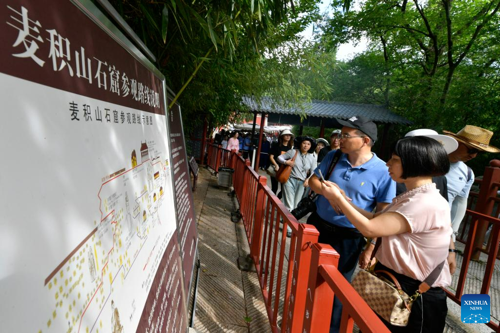 People visit Maijishan Grottoes in Tianshui City, NW China