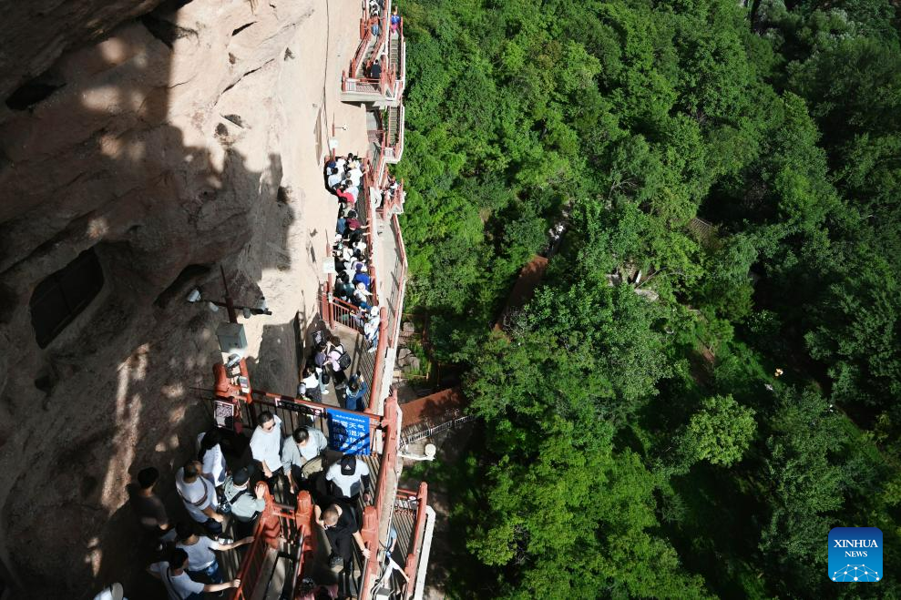 People visit Maijishan Grottoes in Tianshui City, NW China