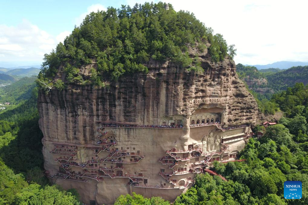 People visit Maijishan Grottoes in Tianshui City, NW China