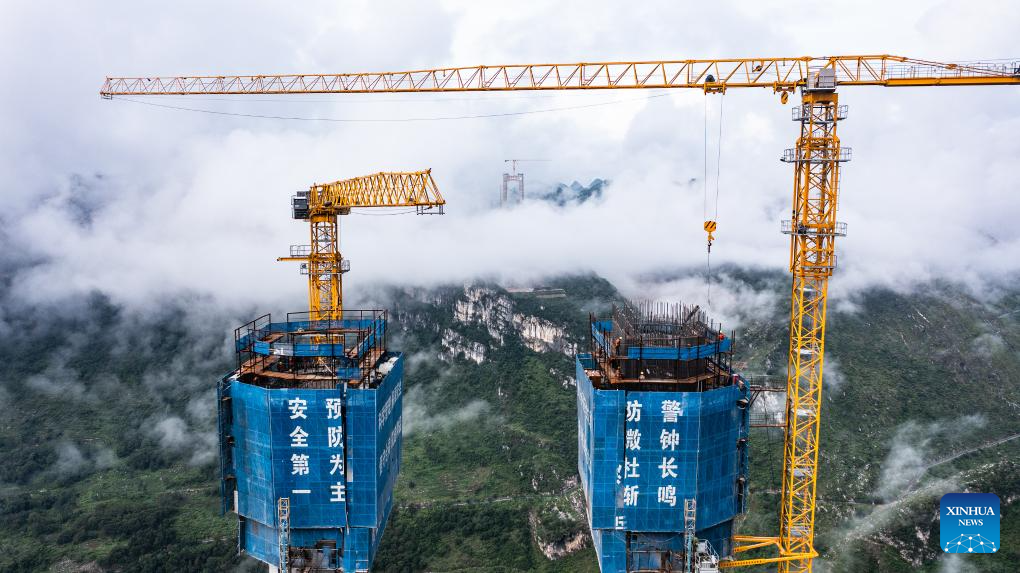 Huajiang grand canyon bridge under construction to become highest in world