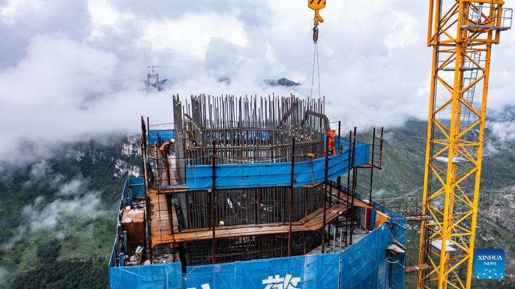 Huajiang grand canyon bridge under construction to become highest in world
