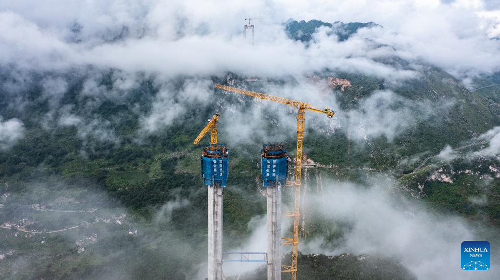 Huajiang grand canyon bridge under construction to become highest in world
