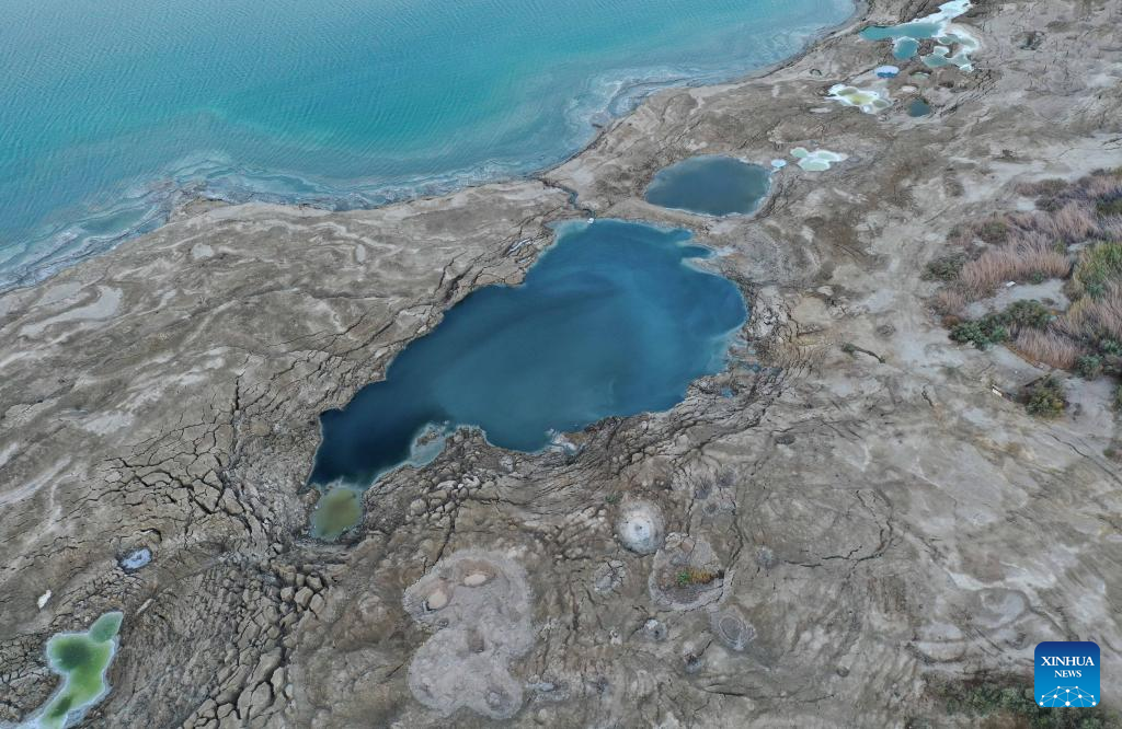 Sinkholes seen on shore of Dead Sea as water level drops