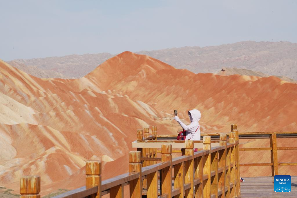 Danxia National Geological Park in NW China attracts tourists with unique landscape