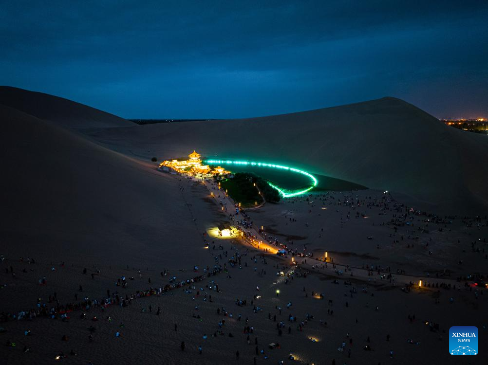 Mingsha Mountain and Crescent Spring scenic spot in Dunhuang enters peak tourist season