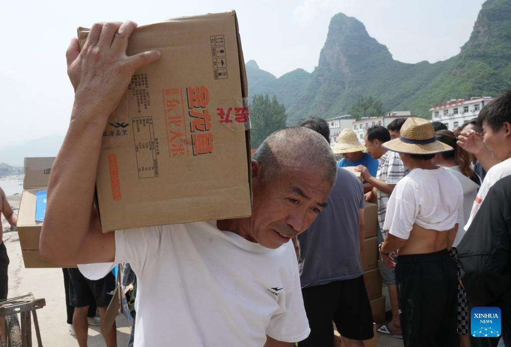 Relief supplies delivered to flood-affected residents in Laishui, N China