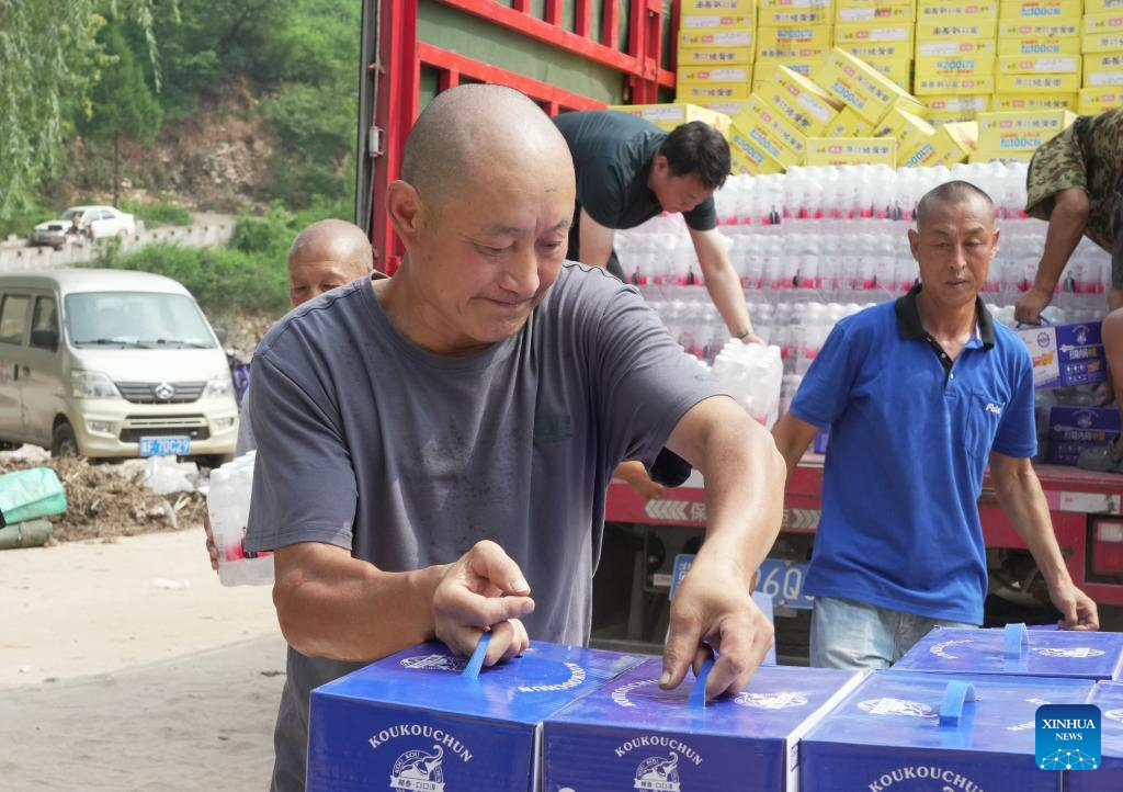 Relief supplies delivered to flood-affected residents in Laishui, N China