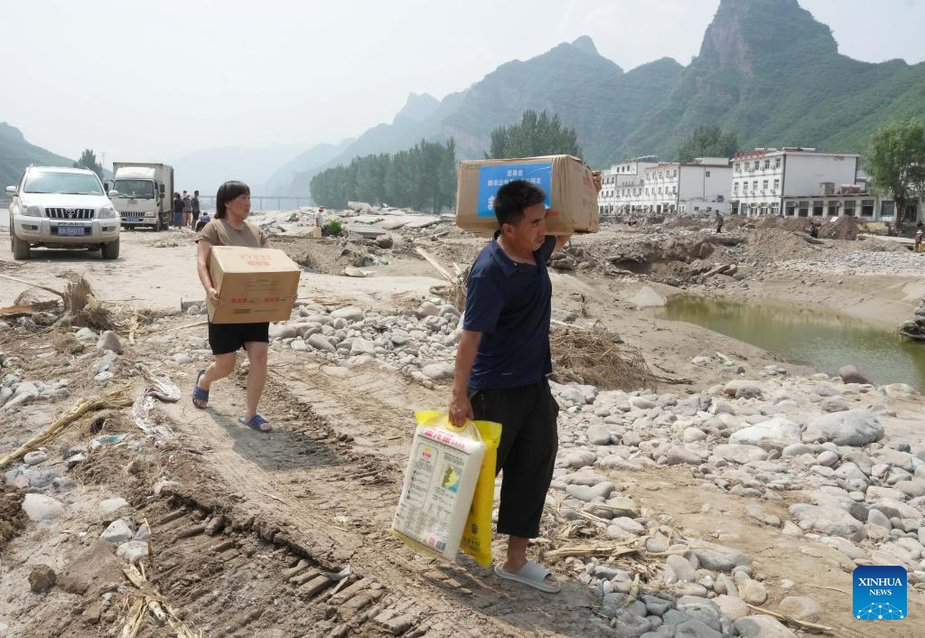 Relief supplies delivered to flood-affected residents in Laishui, N China