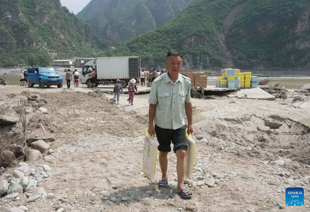 Relief supplies delivered to flood-affected residents in Laishui, N China