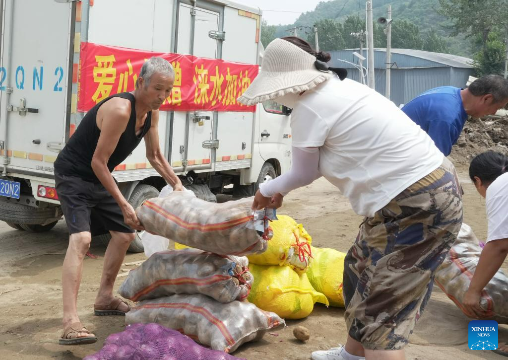Relief supplies delivered to flood-affected residents in Laishui, N China