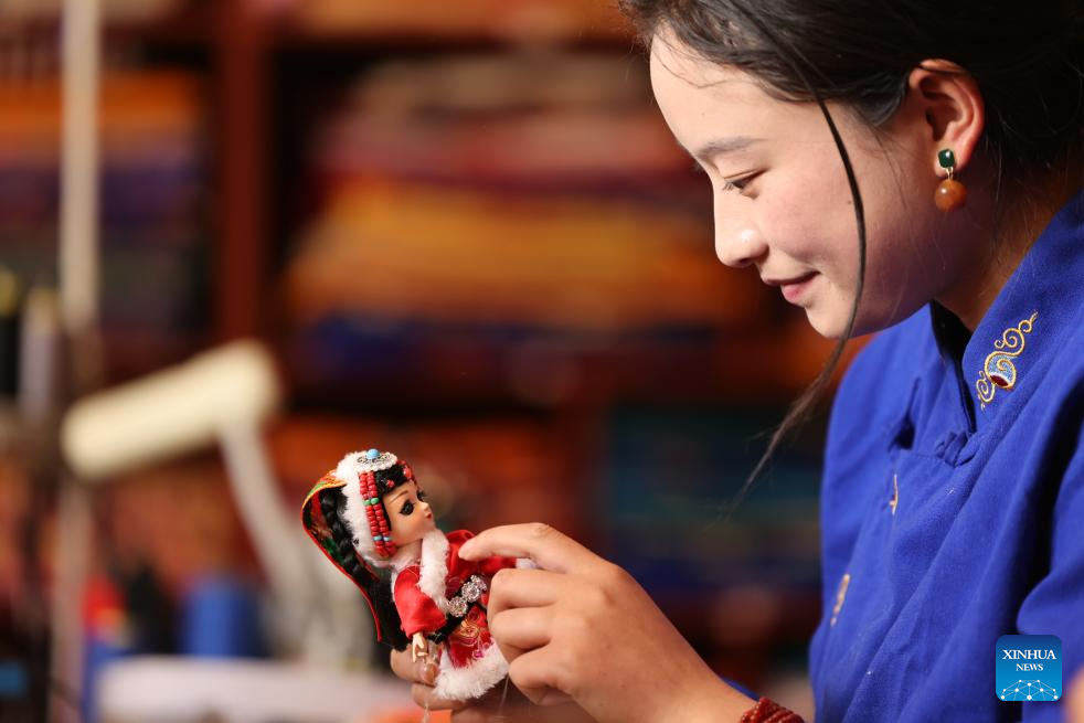 Handmade dolls bring fortunes to local residents in SW China's county