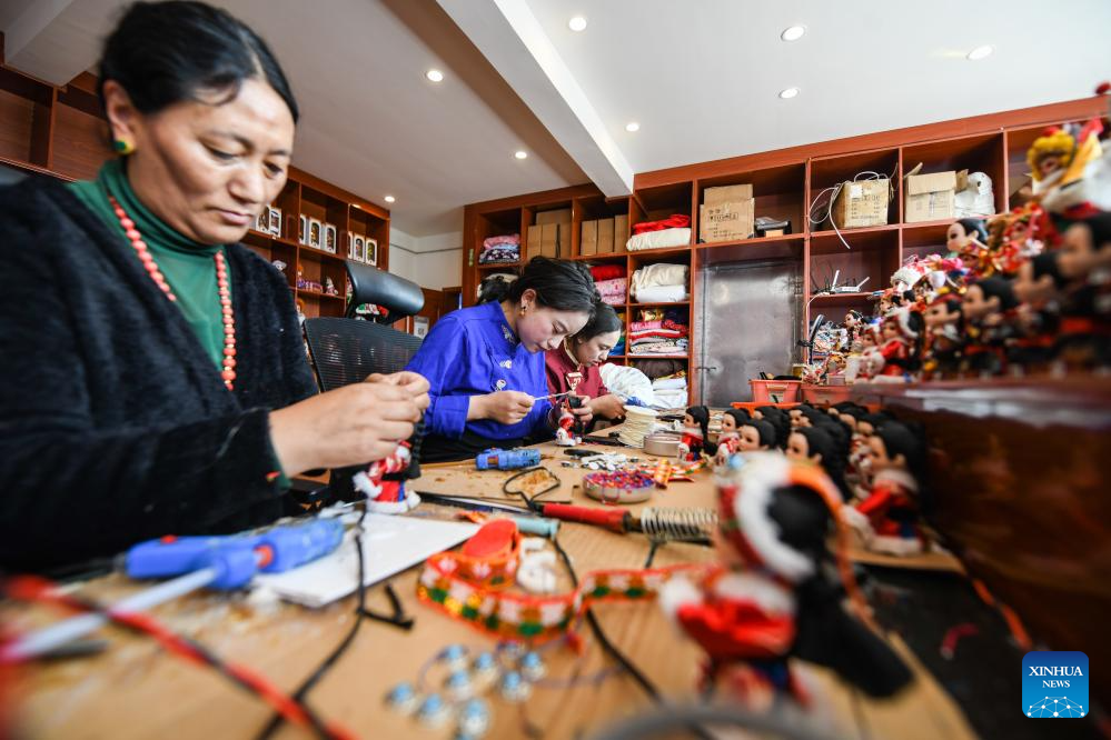 Handmade dolls bring fortunes to local residents in SW China's county