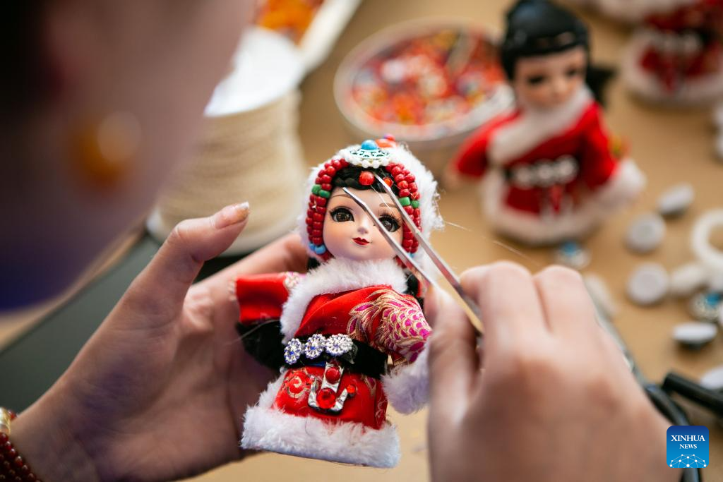 Handmade dolls bring fortunes to local residents in SW China's county