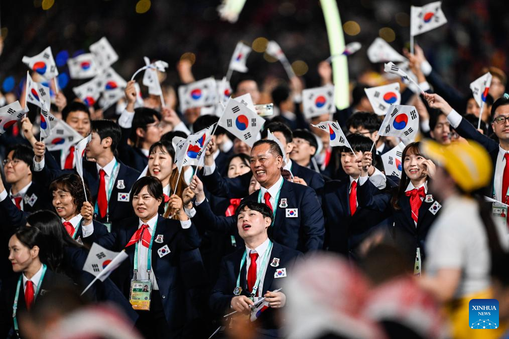Delegations parade into stadium during opening ceremony of 4th Asian Para Games in Hangzhou