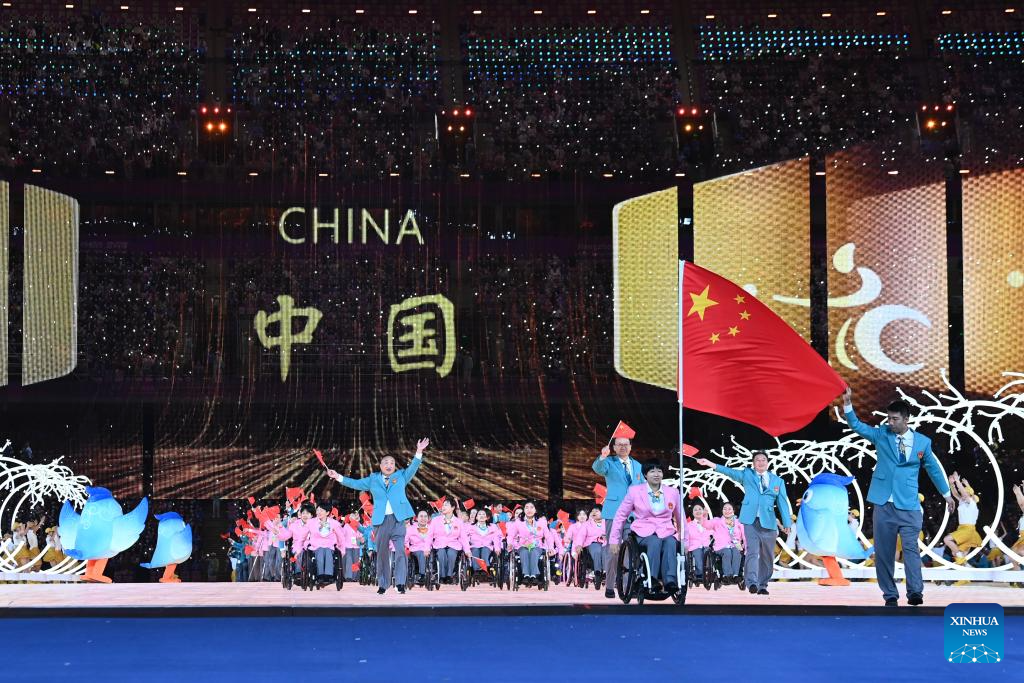 Delegations parade into stadium during opening ceremony of 4th Asian Para Games in Hangzhou