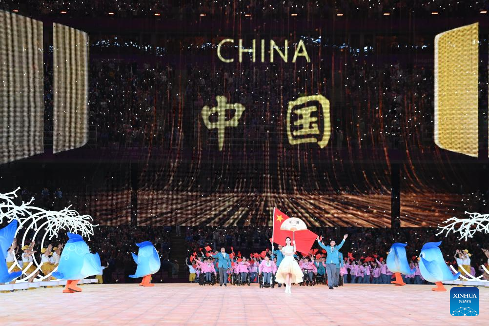 Delegations parade into stadium during opening ceremony of 4th Asian Para Games in Hangzhou