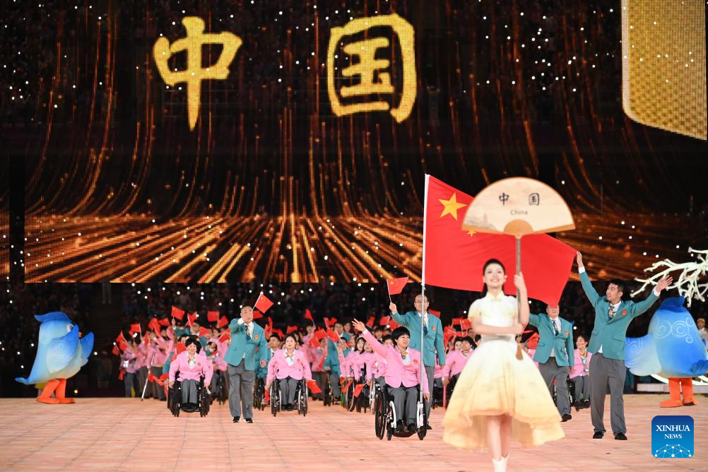 Delegations parade into stadium during opening ceremony of 4th Asian Para Games in Hangzhou